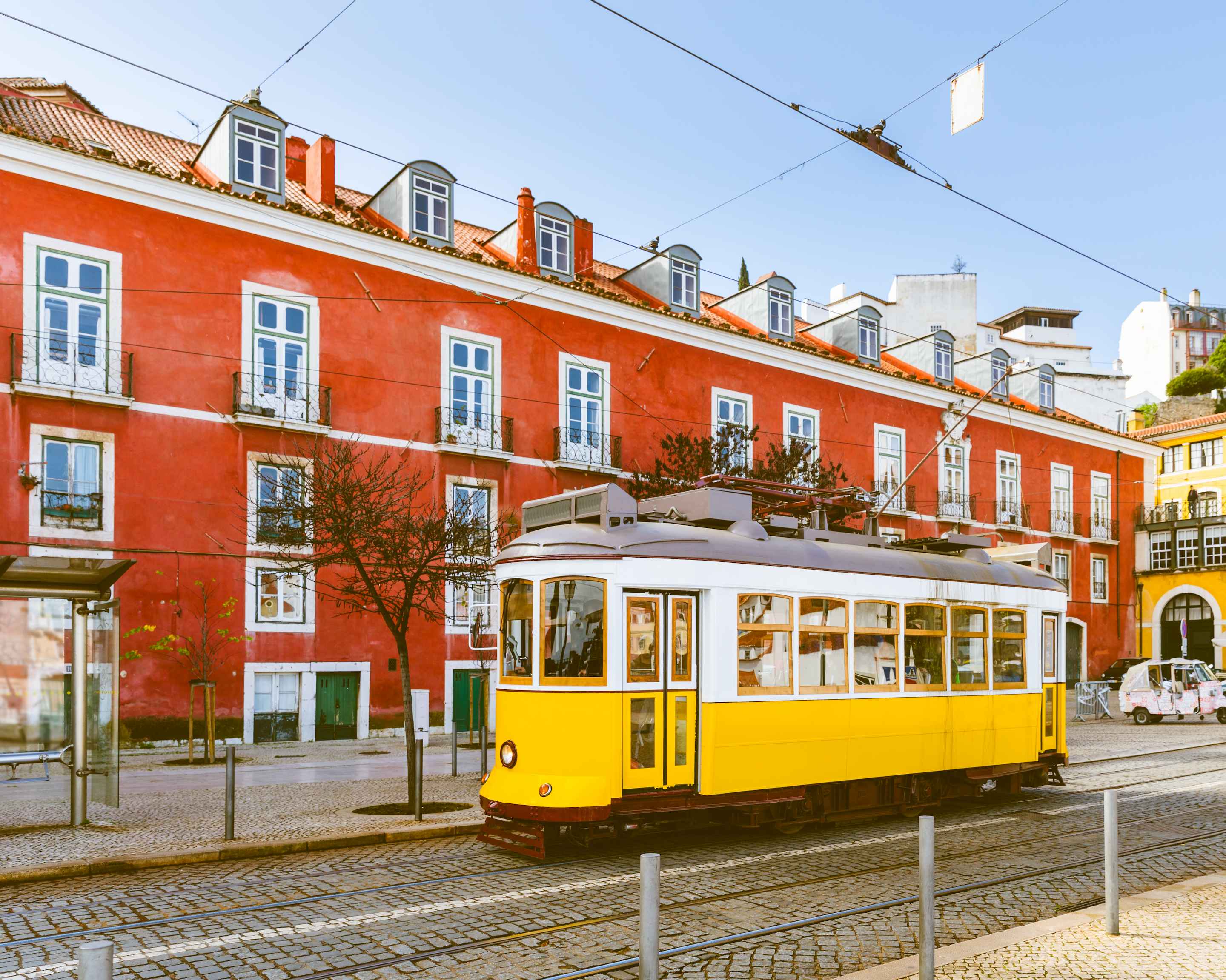 Yellow tram running through the centre of Lisbon, Portugal